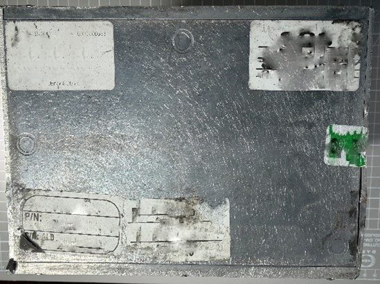 Flight Controller Unit (FCU) — Underside: part-number and serial-number stickers scraped off