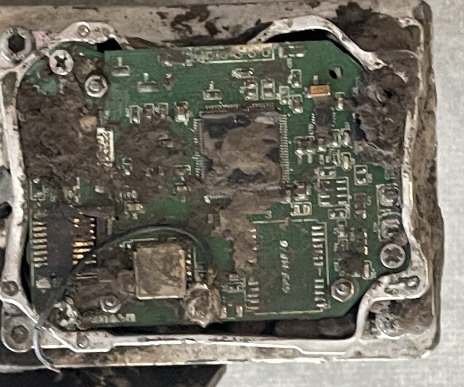 Inertial navigation system MINSOO V3 — The navigation board in its cast housing, fouled by the crash