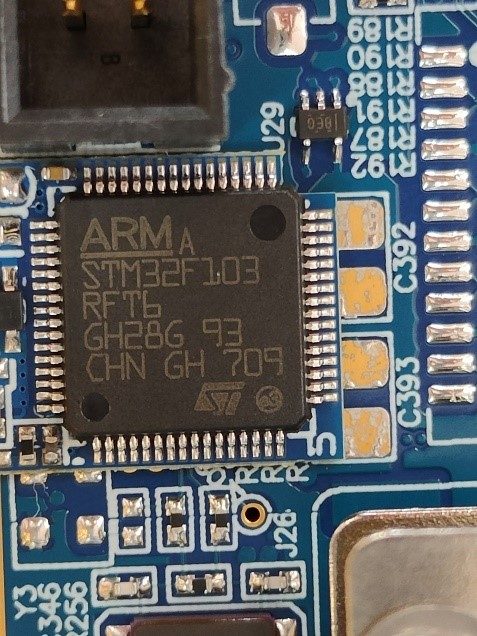 32-bit microcontroller on the base, marked ARM STM32F103 RFT6 GH28G 93 CHN GH 709