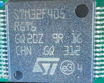 A 32-bit microcontroller, marked STM32F405RGT6 GQ20Z 9R 1G CHN GQ 312